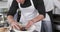 Caucasian male chef decorating meal in kitchen, slow motion