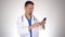 Caucasian male doctor using smartphone