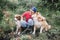 Caucasian male engaged in an affectionate moment with his canine companions