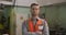 Caucasian male factory worker at a factory wearing a high vis vest