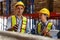 Caucasian male and female engineers team standing on the shelf stored in the warehouse Use your tablet and clipboard to check