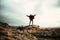 Caucasian male hiker reaching top of mountain peak with open arms