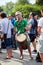 Caucasian male percussionist playing rhythm with his djembe drum bongo