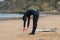 Caucasian male surfer getting ready to go surfing in the ocean