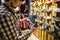 Caucasian man chooses and measures hiking boots at a sports and travel store. Man looking at hiking shoes in outdoor