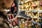 Caucasian man chooses and measures hiking boots at a sports and travel store. Man looking at hiking shoes in outdoor