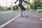 Caucasian man with disability riding skateboard in park