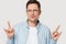 Caucasian man in glasses show cool rock hand gesture