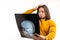 Caucasian man in his 30s wearing yellow sweater and analysing x-ray of his skull transparent image