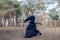 Caucasian man with a Japanese sword, a katana practicing Iaido