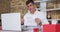 Caucasian man making video call using laptop holding handwritten sign making marriage proposal