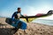 Caucasian man professional surfer standing  on the sandy beach with his kite and board