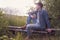 Caucasian man sitting outdoor resting after hiking.