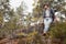 Caucasian man sitting outdoor resting after hiking.