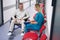Caucasian man in wheelchair talking to doctor in hospital corridor
