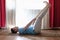 Caucasian man in yoga pose laying on back with legs up using belt