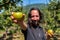 Caucasian man in You pick apple orchard