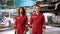 Caucasian mechanic who specializes in car repairs Standing in a large mechanic\\\'s red suit. Standing with a smile showing
