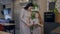Caucasian mother and daughter in similar dresses choosing kitchen color standing in shop indoors. portrait of positive