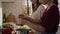 Caucasian mother teaching daughter how cook the soup.