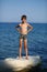 Caucasian nine year old boy sunbathing on the rock on the cyprus seashore