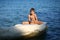 Caucasian nine year old boy sunbathing on the rock on the cyprus seashore