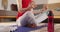 Caucasian non-binary transgender woman practicing yoga, meditating