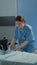 Caucasian nurse making hospital ward bed for use