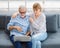 Caucasian old senior elderly lovely lover grandparents romantic couple gray hair and bearded husband and wife sitting smiling