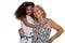 Caucasian older woman hugging her african american granddaughter