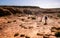 Caucasian people walking under a blazing sun during Rim walking trail at Kings Canyon in outback Australia