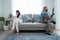 Caucasian phone addict couple don`t pay attention with each other. Family problem, New marriage man and woman partner sit on sofa