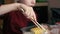 Caucasian preschool boy with appetite eats Japanese sushi with chopsticks. Child eats with chopsticks. Selective focus, shallow de