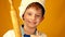 Caucasian preschooler boy in cook uniform and hat with rolling pin shows thumbs up. Portrait of child cook. Boy chef in chefs hat.