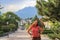 Caucasian red-haired girl tourist smiles in the central part of the small town of Van near Vaduz.