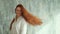 Caucasian Redhead Woman Shaking Long Straight Hair. Red head girl.