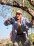 Caucasian senior fmale picking olives at olive tree plantations