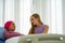 Caucasian senior woman with breast cancer patient lying on hospital bed with young european daughter supporting