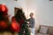 Caucasian senior woman decorate for Christmas at home. Family celebrate and Happy new year at home