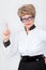 Caucasian senior woman pointing with forefinger, elderly lady wearing eyeglasses is a on grey background