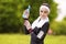 Caucasian Sportive Woman Drinking Water During Her Regular Joggong Workout Outdoors.