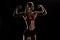 Caucasian sportswoman flexing biceps and looking away