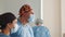 Caucasian surgeon male healthcare professional in a hospital operating theater wearing a surgical cap and mask