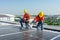 Caucasian technician workers use screwdriver to maintenance and fix the problem of the solar cell panels on rooftop of the