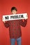 Caucasian teen boy holding no problem sign.