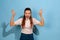 Caucasian teen girl portrait isolated on blue studio background