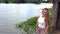 Caucasian Teen Girl At River White Top Pants Half-Length Hair Blowing In Wind Slow Motion