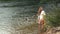 Caucasian Teen Girl Standing In River White Leotards