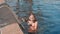 Caucasian teen girl swimming underwater in pool