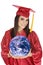 Caucasian teenager wearing a graduation gown holding the earth